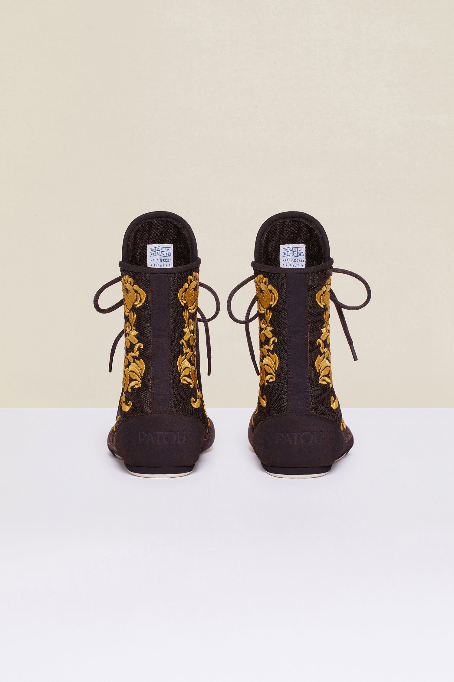 Patou - Embroidered high-top trainers - Havana - Havana - Couture florals are stepping in the ring!Ongoing collaboration between Patou and Le Coq Sportif. Brown high-top trainers inspired by classic boxing shoes. Gold floral embroideries. Patou logo engraved on the heel. Original Le Coq Sportif logo on the tongue. Flexible rubber sole with embossed Patou logo.