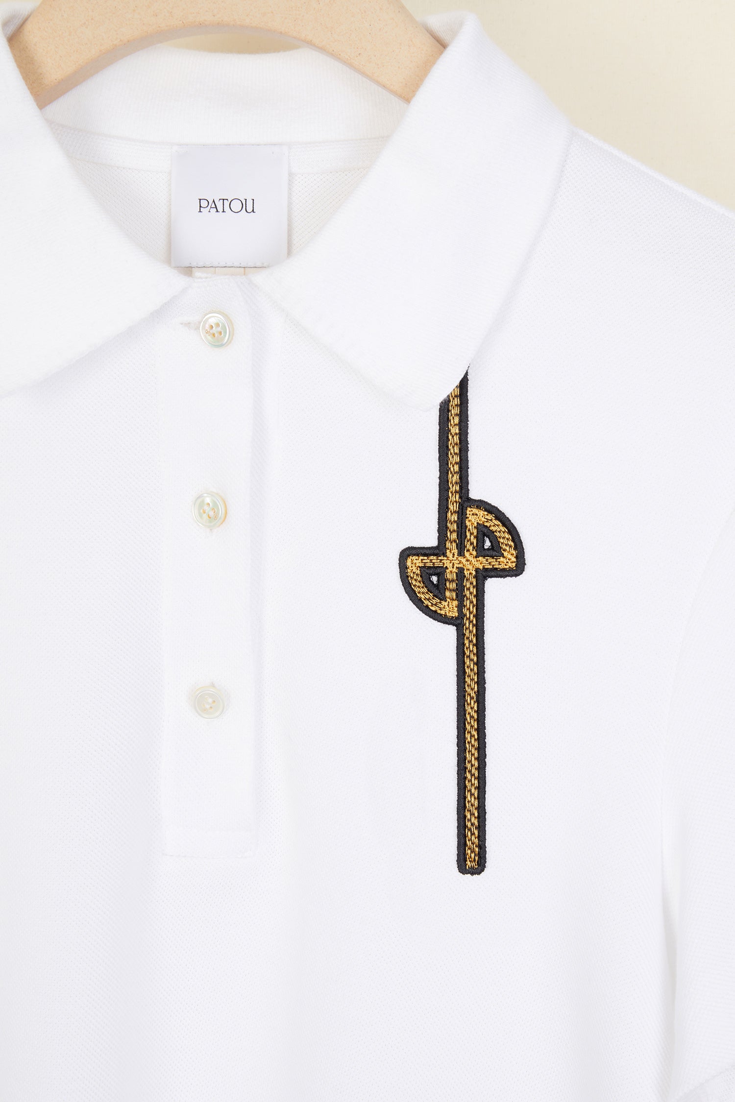Patou - Logo cotton polo shirt - White - A polo we love!White cotton polo shirt with revisited JP logo in gold. Buttoned collar. Slightly flared silhouette.
