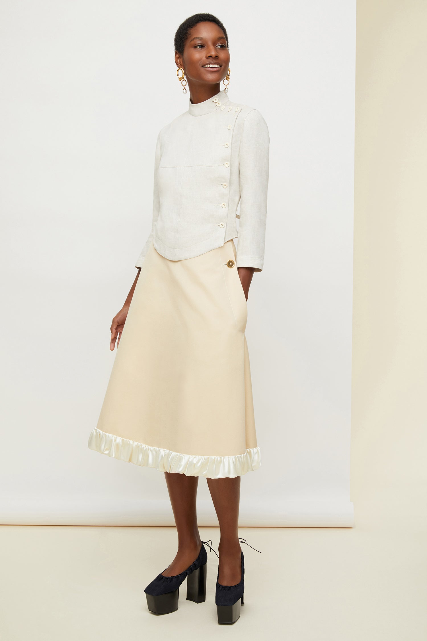 Patou - Cotton safari skirt - Vanilla - The summer skirt goes on an adventure.Vanilla Panama cotton midi skirt. A-line silhouette designed to sit slightly lower on the waist. Two side pockets with JP logo-engraved gold buttons. Zip fastening at the back. Ruffled bubble hem in contrasting satin.