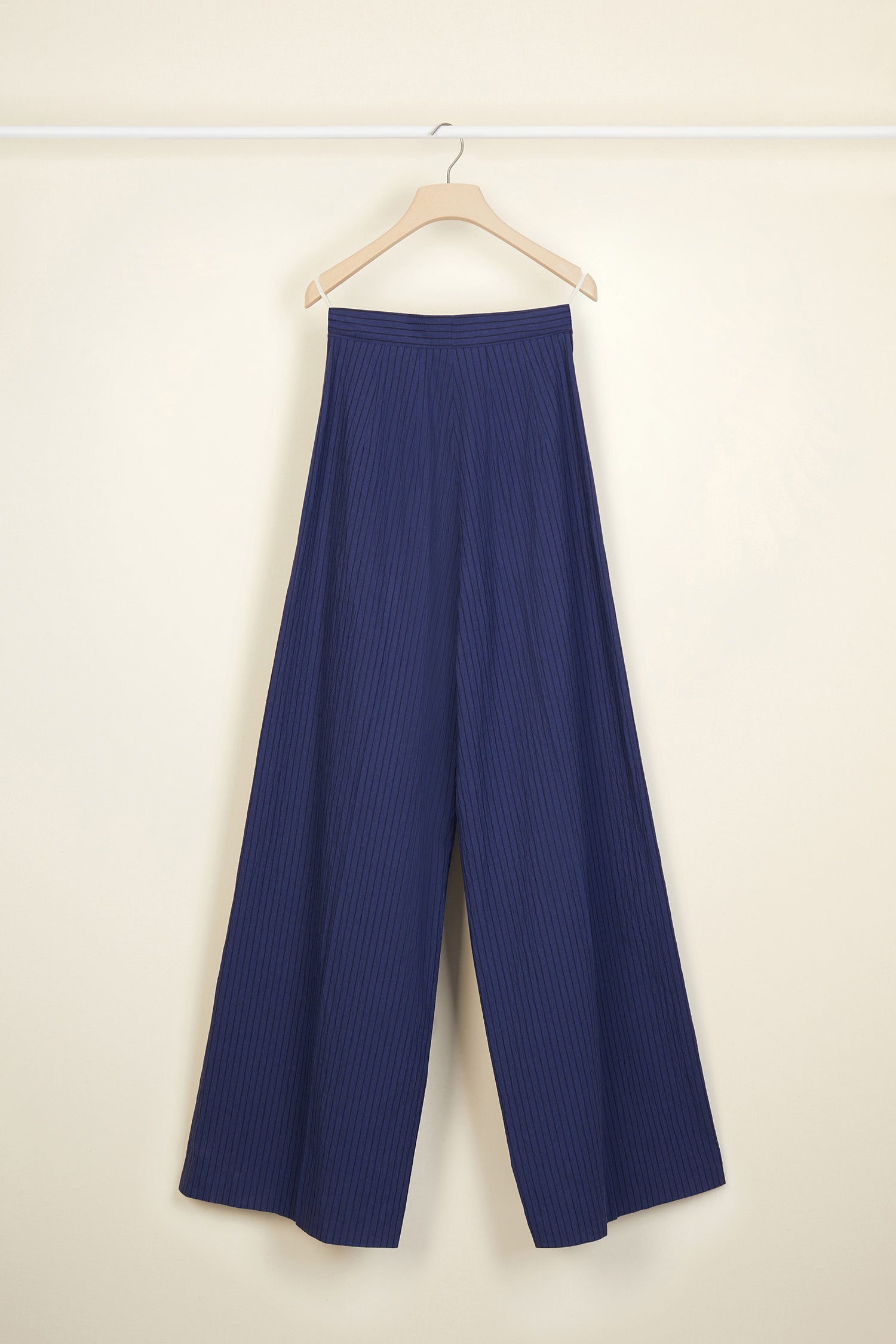 Patou - Loose belted seersucker trousers - Persian Blue - The new seersucker.Persian blue cotton and linen seersucker trousers. Loose fit. High-waisted style with a partly detached belt. JP logo-engraved button. Darts at the front, pockets at the sides.