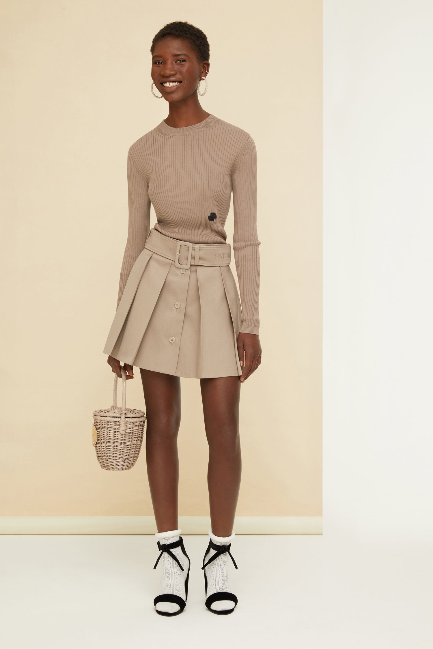 Patou - Belted pleated mini skirt in organic cotton - Parchment - Set, game and a perfect style match!Parchment beige organic cotton skirt. Short length. Adjustable belt at the waist with fabric-covered buckle. Belt loops. Wide pleats. Button fastening at the front.