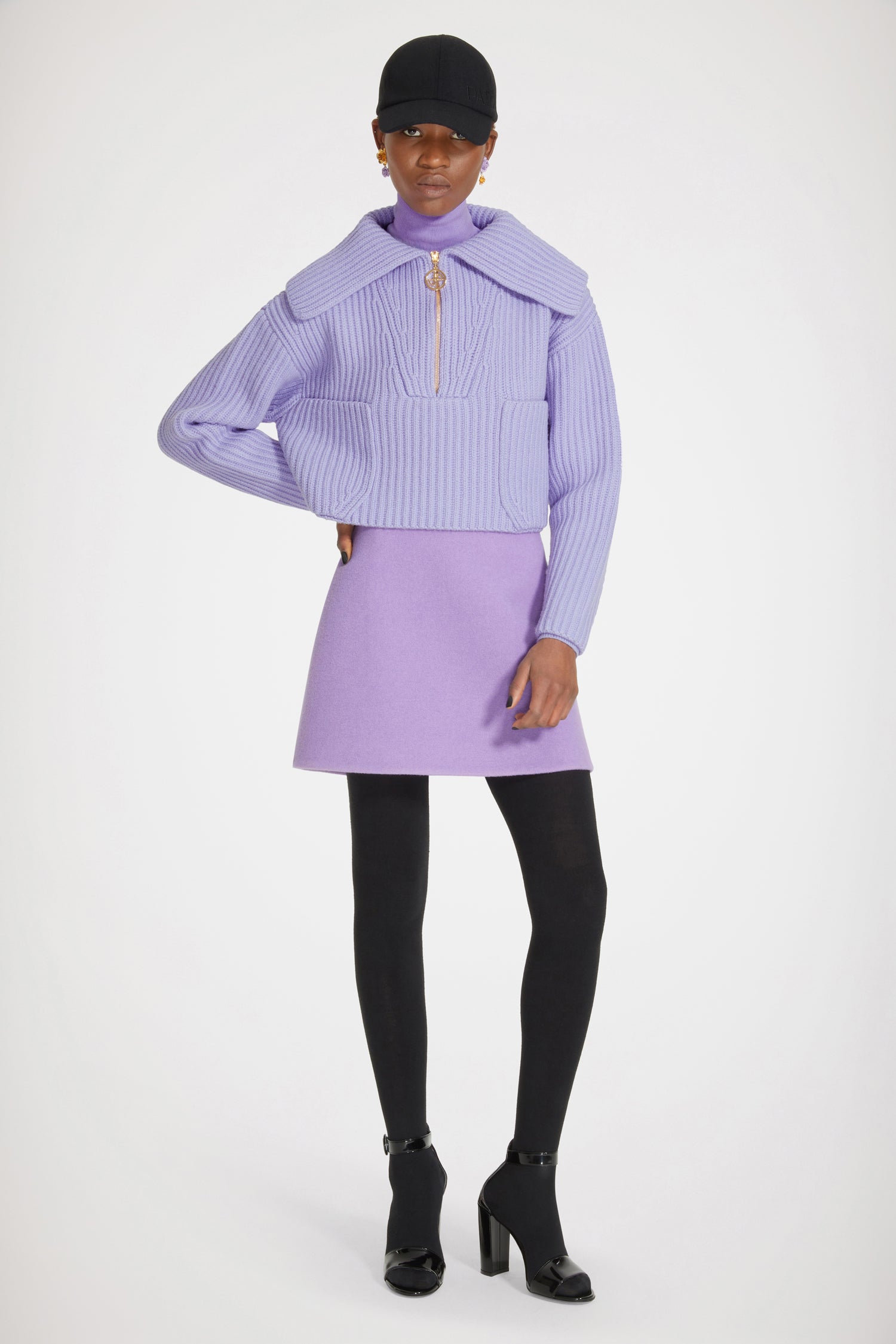 Patou - Mini jupe en laine double face - Violet - Patou, l'allure avant tout.Jupe en laine double face violette. Coupe courte. Zip au dos.