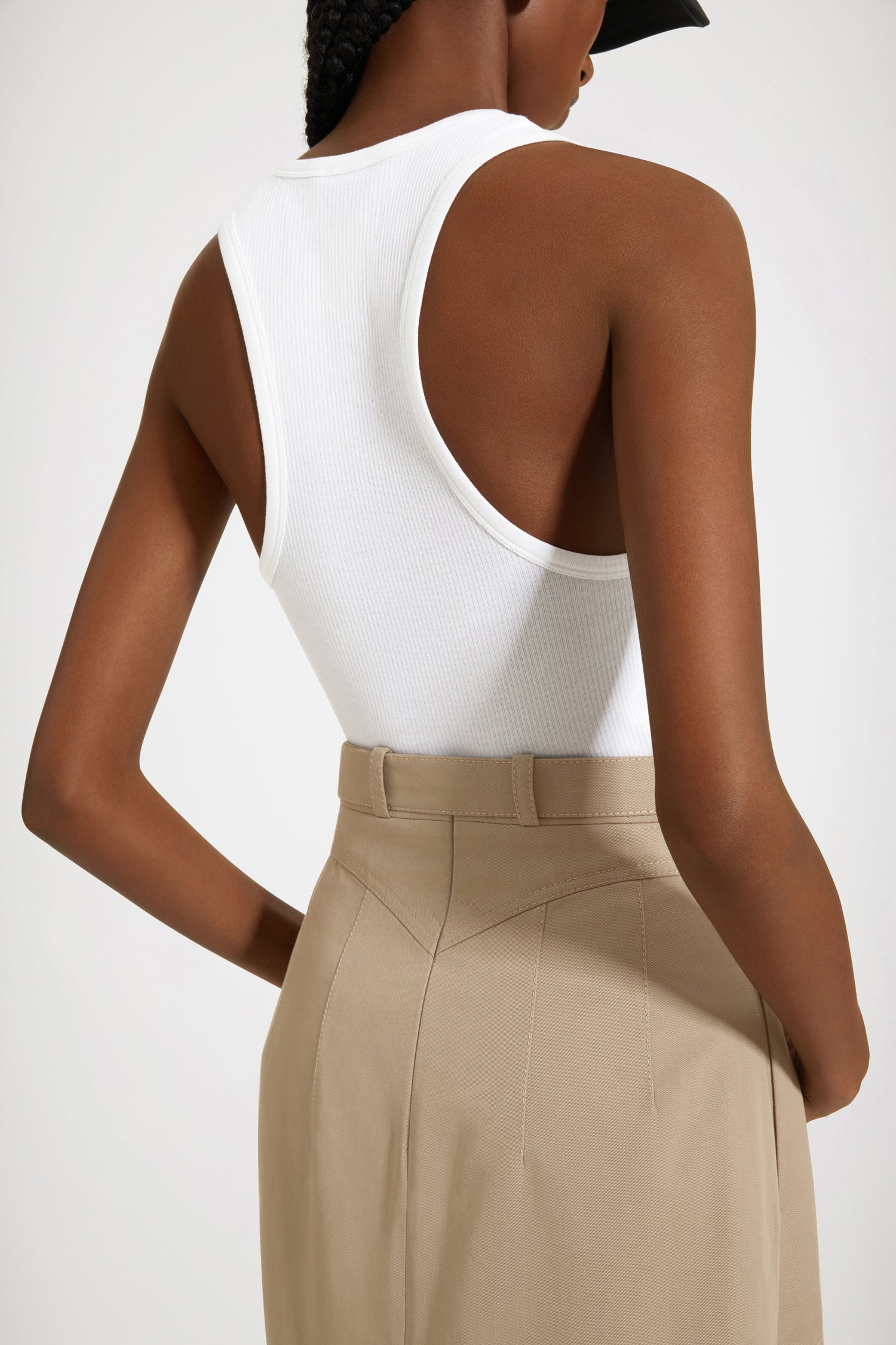 Patou - Pocket midi skirt in organic cotton - Parchment - Statement pockets make for a sensational skirt.Parchment beige organic cotton garbardine skirt. Midi length. A-line construction. Adjustable belt at the waist with gold-tone buckle and belt loops. Maxi pockets at the front. V seam and darts at the back. Tonal topstitching.
