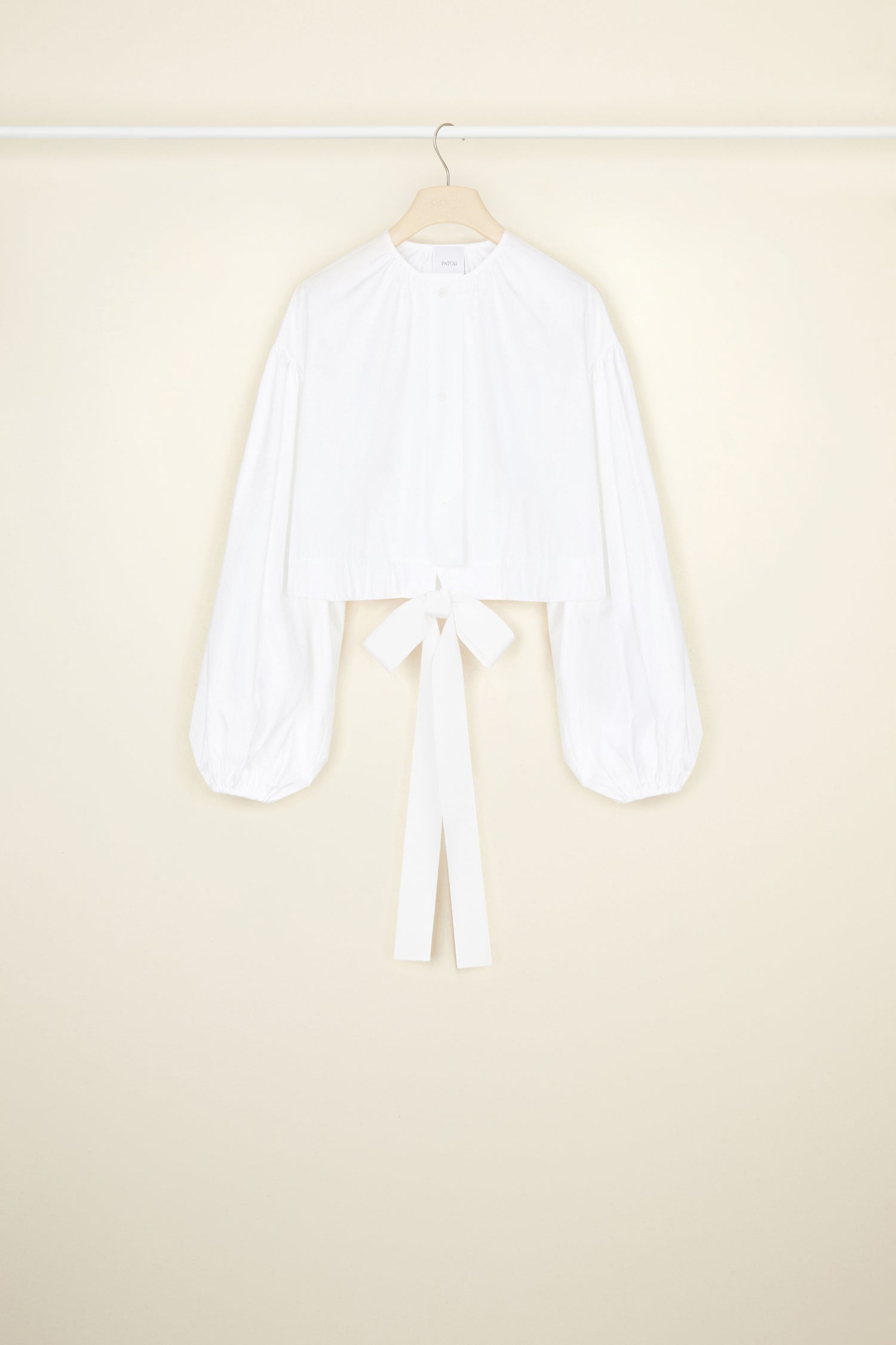 Patou - Cropped volume top in organic cotton - White - Volume for (happy) days.White organic cotton top. Cropped silhouette. Round neckline. Button fastening down the front. Volume sleeves with elasticated cuffs. Drawstring waistband with grosgrain ties.