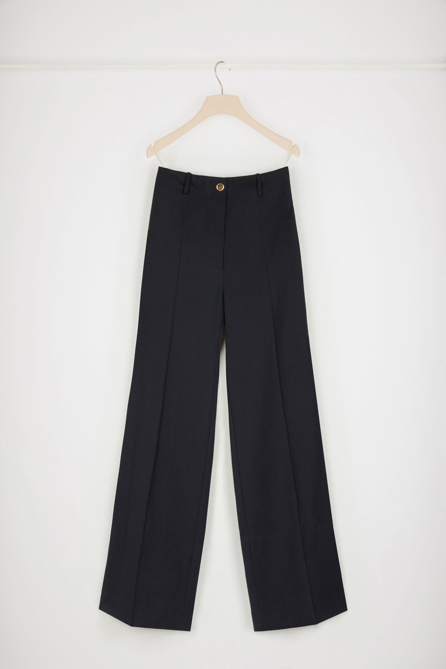 Patou - Iconic long trousers in virgin wool - Night Blue - Flawless tailoring with a smile: a life in Patou.Night blue stretch virgin wool trousers. Iconic Patou silhouette. Straight fit. Fastens via a gold-coloured JP-engraved button and zip at the front. Belt loops, two pockets at the sides. Signature darts at the back.