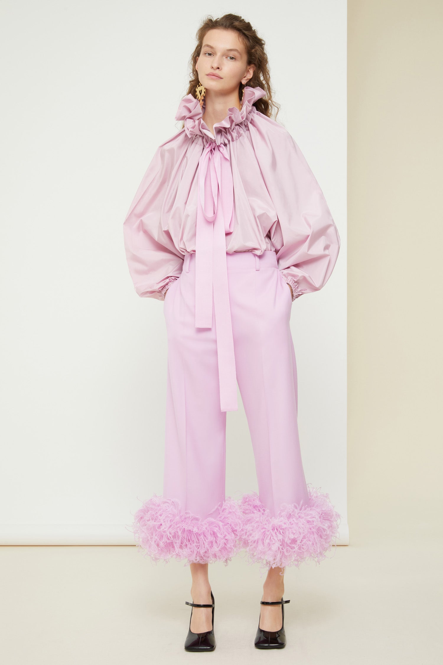 Patou - Trousers with feather hem in eco-friendly wool - Lavender - Flawless tailoring takes flight in a cloud of feathers.Lavender pink eco-friendly wool twill trousers. Cropped silhouette with a straight leg. Button fastening via gold-coloured engraved button at the front. Belt loops. Pockets at the sides. Signature curved seam at the back. Ostrich feather-embellished hem.