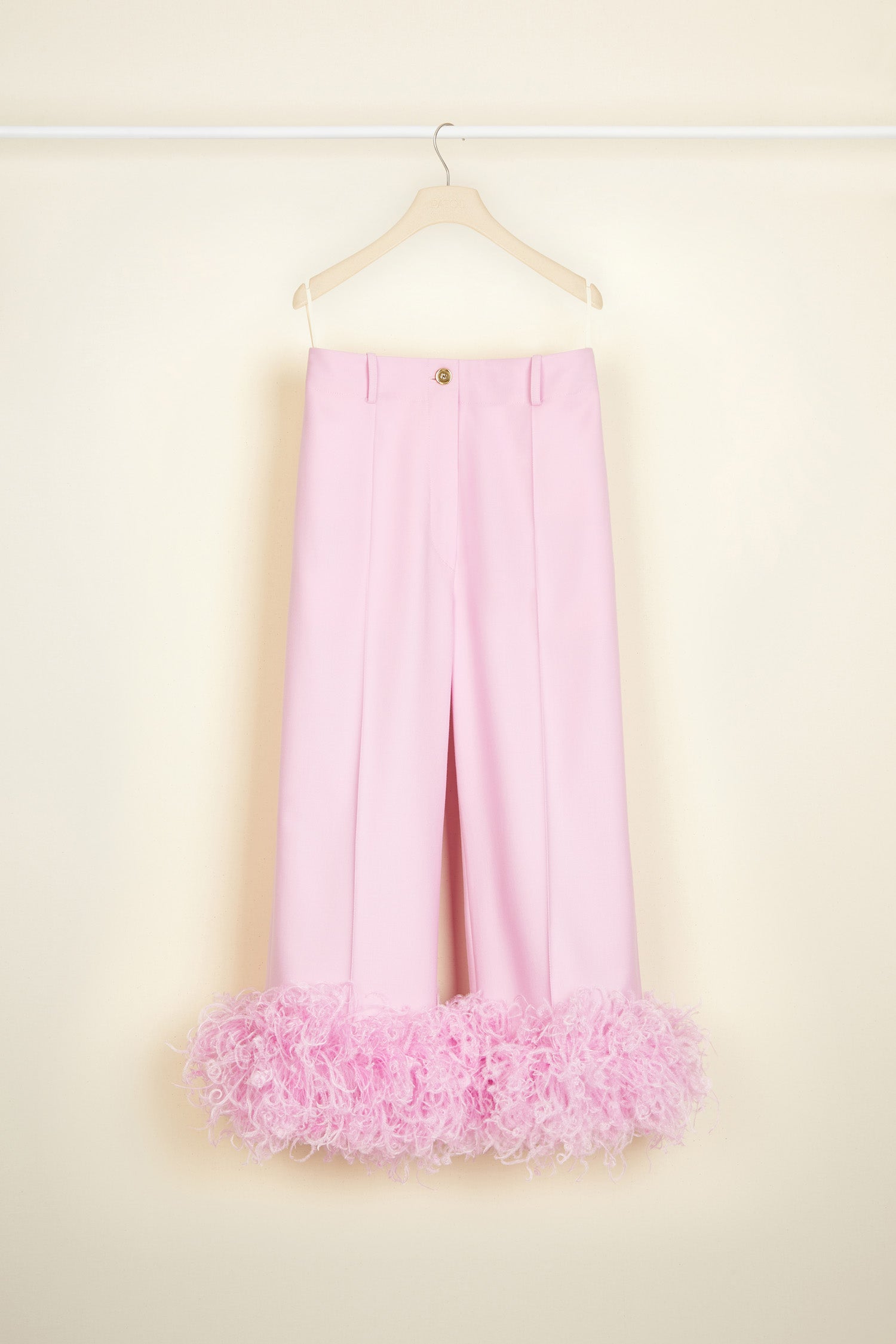 Patou - Trousers with feather hem in eco-friendly wool - Lavender - Flawless tailoring takes flight in a cloud of feathers.Lavender pink eco-friendly wool twill trousers. Cropped silhouette with a straight leg. Button fastening via gold-coloured engraved button at the front. Belt loops. Pockets at the sides. Signature curved seam at the back. Ostrich feather-embellished hem.