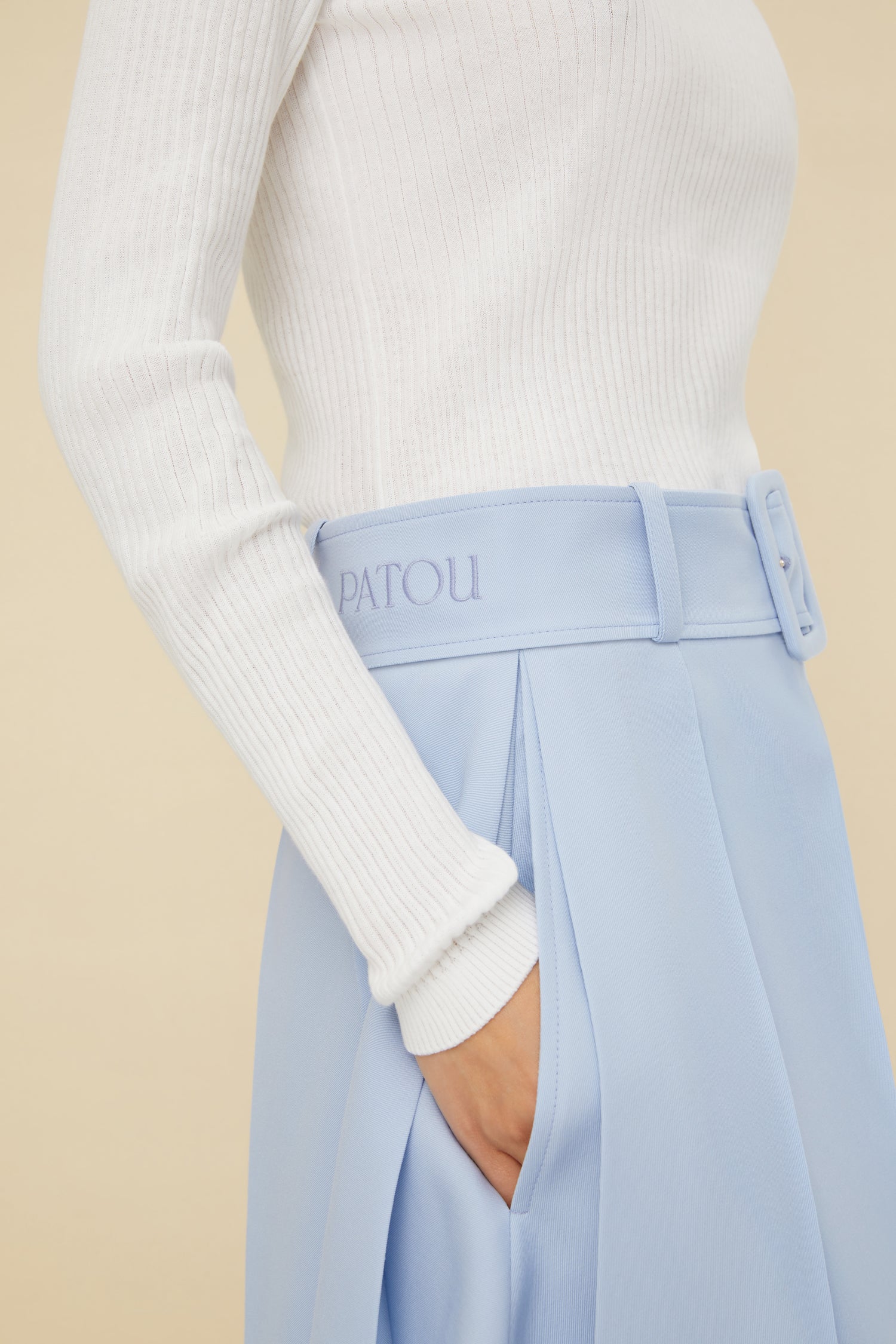 Patou - Belted pleated wool shorts - Sky Blue - Patou’s shortcut to chic. Sky Blue stretch virgin wool shorts. Adjustable belt at the waist with fabric-covered buckle. Patou lettering logo embroidered on the waistband. Belt loops. Wide pleats. Button fastening at the front. Pockets at the sides.