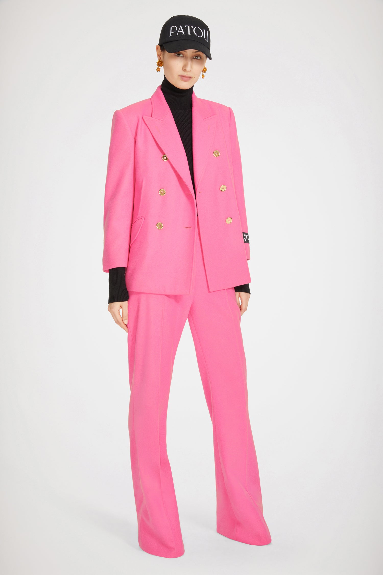 Patou - Flared trousers in responsible wool and cashmere - Darling Pink - Responsible wool, a touch of cashmere and a hint of fantasy: dream trousers by Patou.Darling Pink responsible virgin wool and cashmere trousers. Slightly flared straight leg with crease at the front and back. Eiffel tower construction. Mid rise. Gold-tone Patou button fastening at the front. Belt loops. Pockets at the sides.