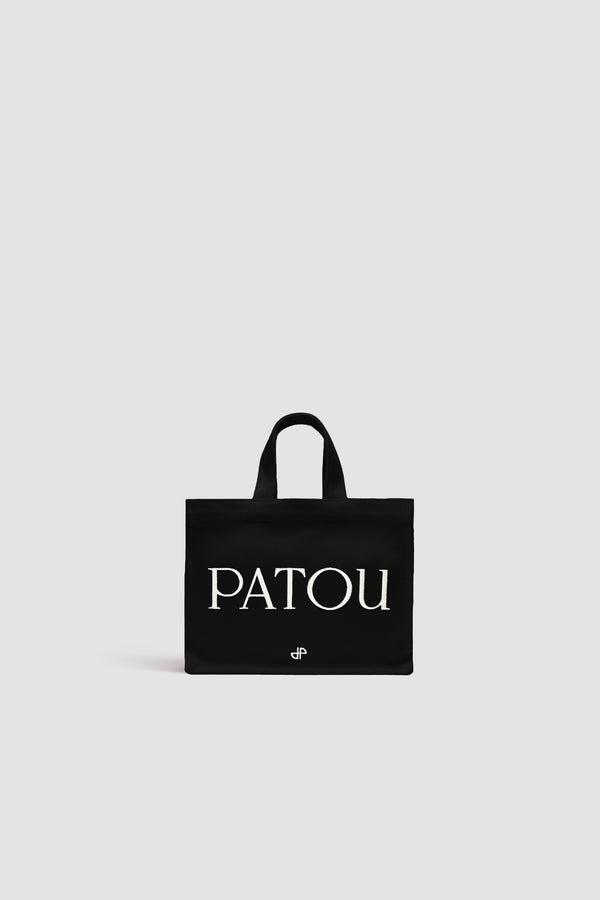 Patou - Small Patou tote in cotton canvas - Black - Black cotton canvas tote. Embroidered Patou and JP. Embossed shoulder strap with gold buttons. Two top handles. Can be carried by hand or on the shoulder.