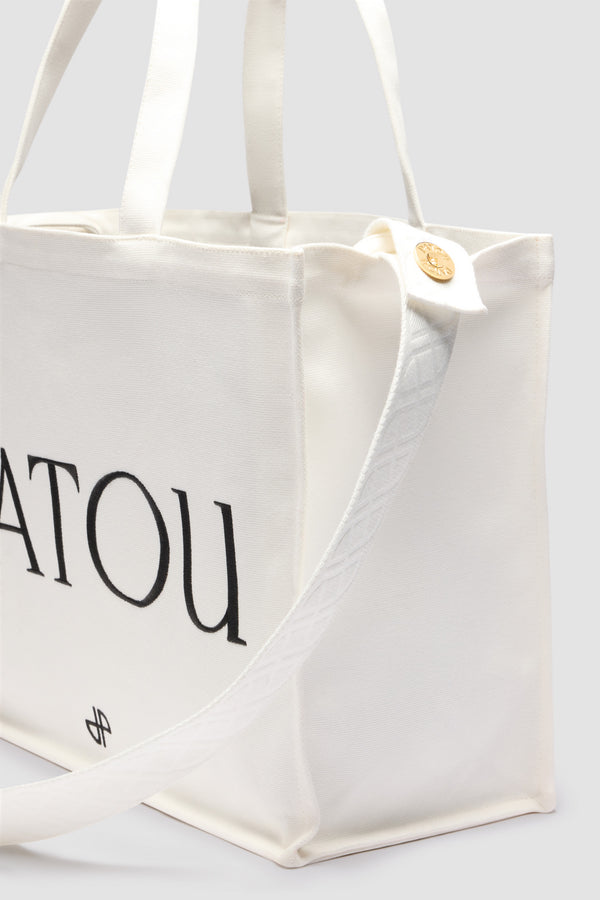 Patou - Tote Patou grande in cotone - White - Borsa in cotone bianco. Logo Patou e monogramma JP ricamati. Tracolla con logo JP e due bottoni oro incisi Patou. Doppio manico. Può essere portata a mano o in spalla.