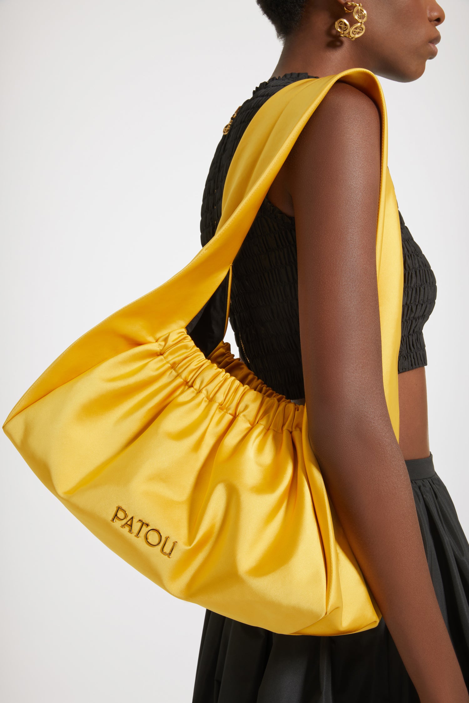 Patou - Le Biscuit large bag - Sun - Origami à Paris!Sun yellow cotton-blend satin bag. Large version. Hobo shape with wide built-in strap. Elasticated opening. Gold-tone metal Patou logo. Cotton lining.