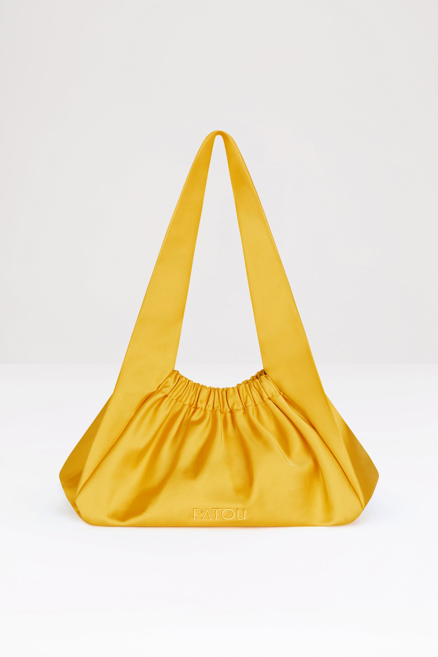 Patou - Le Biscuit large bag - Sun - Origami à Paris!Sun yellow cotton-blend satin bag. Large version. Hobo shape with wide built-in strap. Elasticated opening. Gold-tone metal Patou logo. Cotton lining.