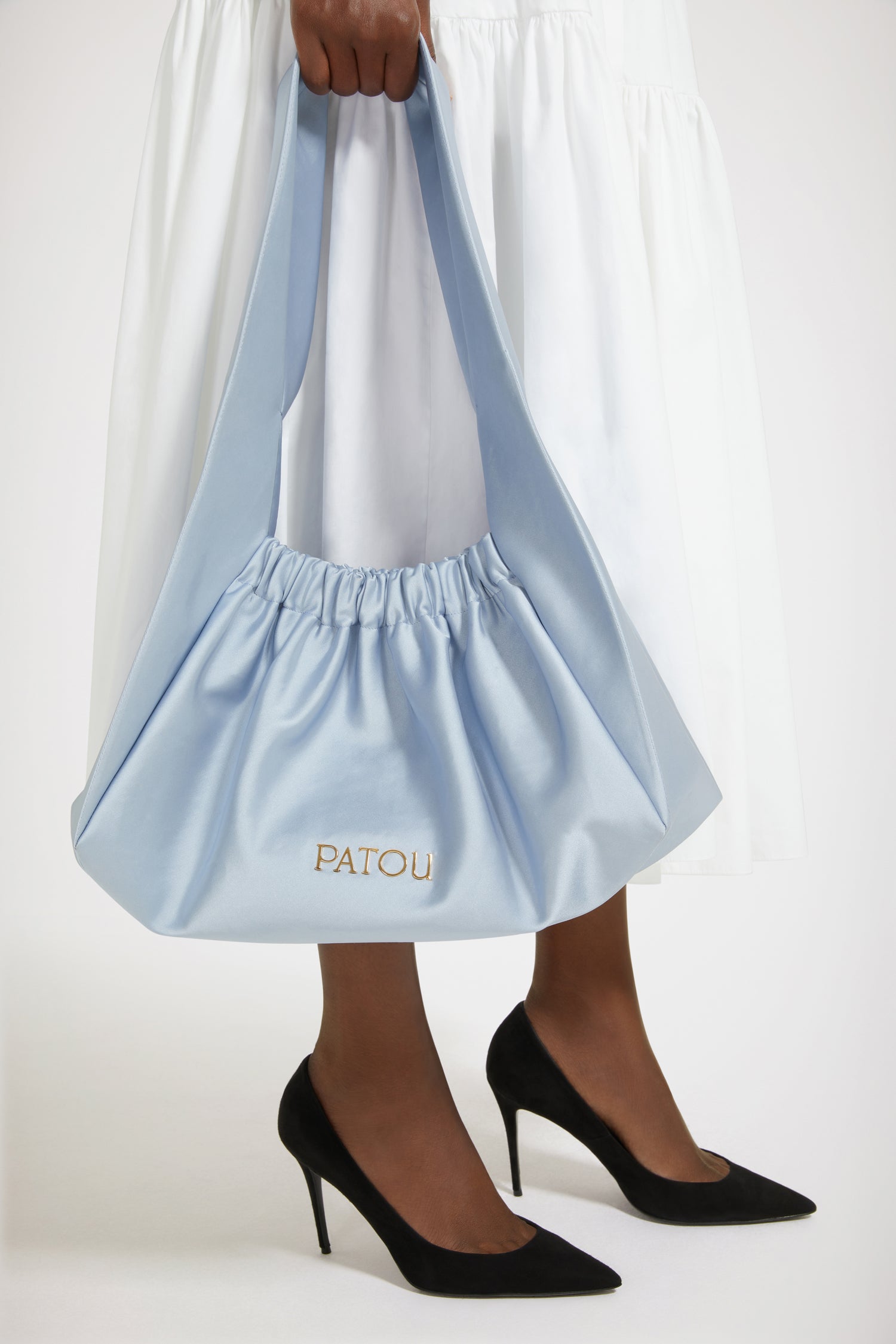 Patou - Le Biscuit large bag - Alaska Blue - Origami à Paris!Alaska Blue cotton-blend satin bag. Large version. Hobo shape with wide built-in strap. Elasticated opening. Gold-tone metal Patou logo. Cotton lining.