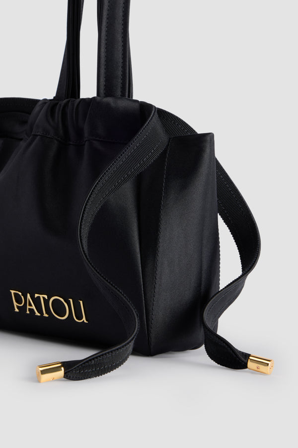 Patou - Evening pouch in recycled satin - Black - Black recycled satin pouch. Drawstring lace fastening. Top handles. Gold-tone metal Patou. Fully lined.