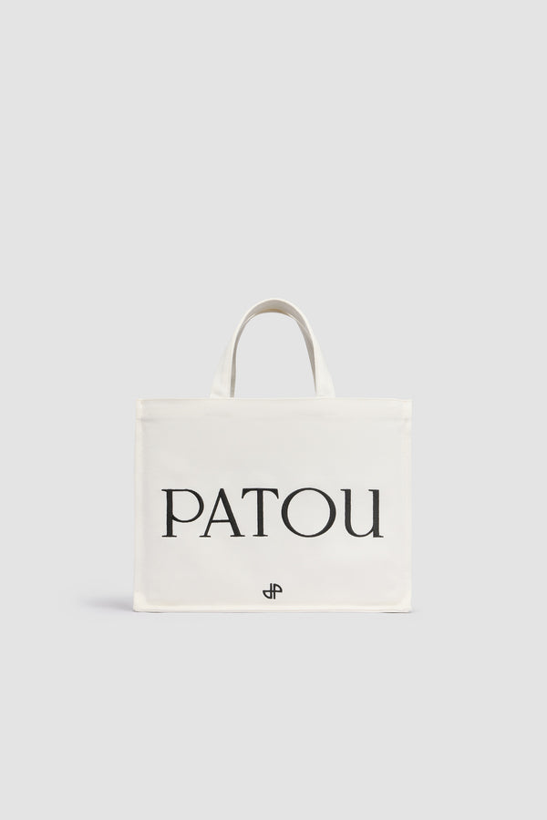 Patou - Medium Patou logo tote in cotton canvas - White - White cotton canvas tote. Medium version. Embroidered Patou logo and JP monogram. Embossed shoulder strap with gold-tone Patou logo-engraved buttons. Two top handles. Can be carried by hand or on the shoulder.