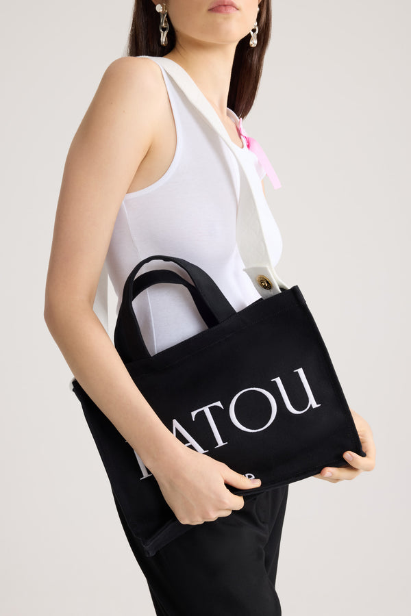 Patou - Medium Patou logo tote in cotton canvas - Black - Black cotton canvas tote. Medium version. Embroidered Patou logo and JP monogram. Embossed shoulder strap with gold-tone Patou logo-engraved buttons. Two top handles. Can be carried by hand or on the shoulder.