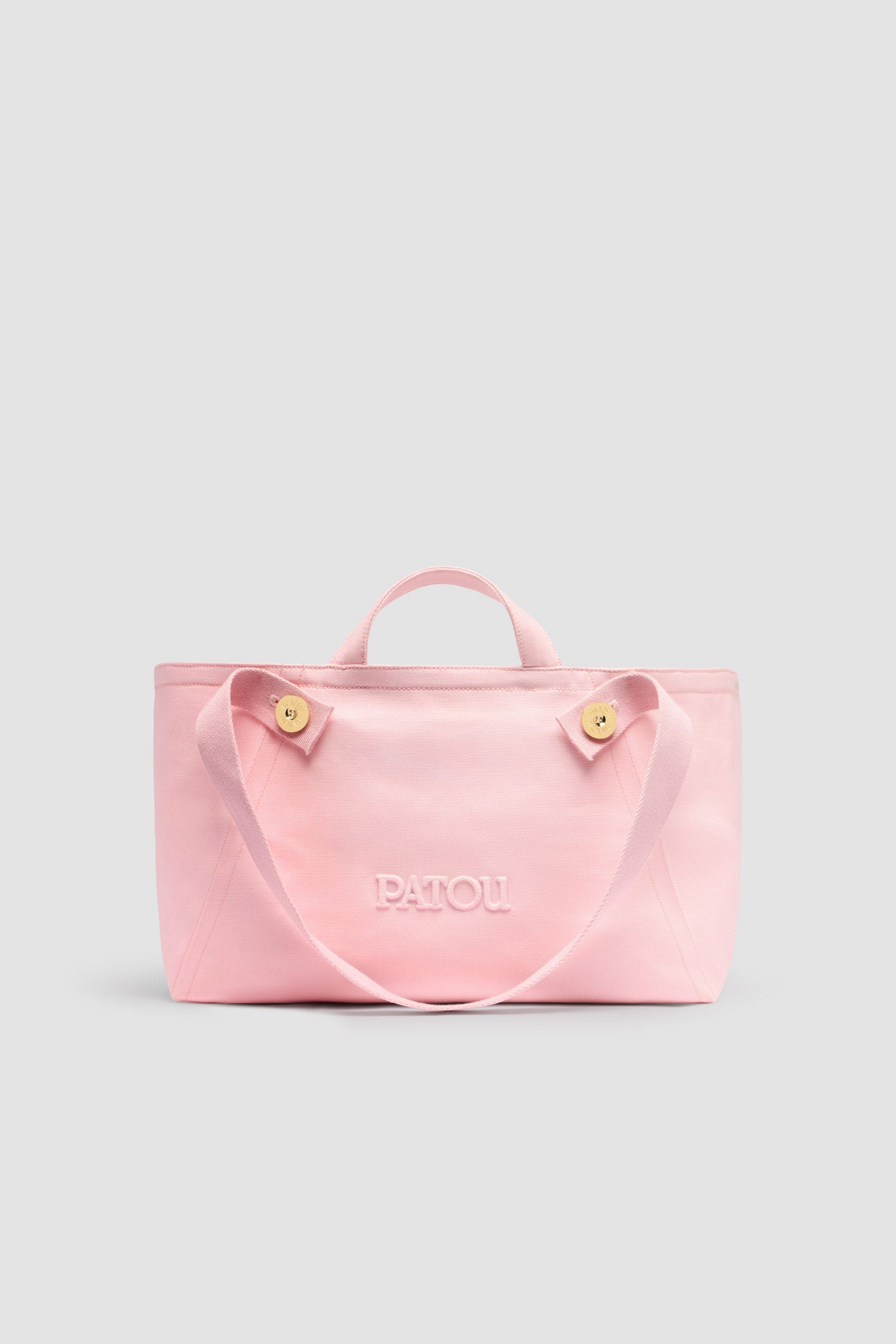 Patou - Large Patou logo trapeze tote in cotton canvas - Primrose Pink - Primrose Pink cotton canvas tote. Large version. Trapeze shape. Two top handles, two shoulder straps attached via gold-tone Patou logo-engraved buttons. Embroidered Patou logo at the front.