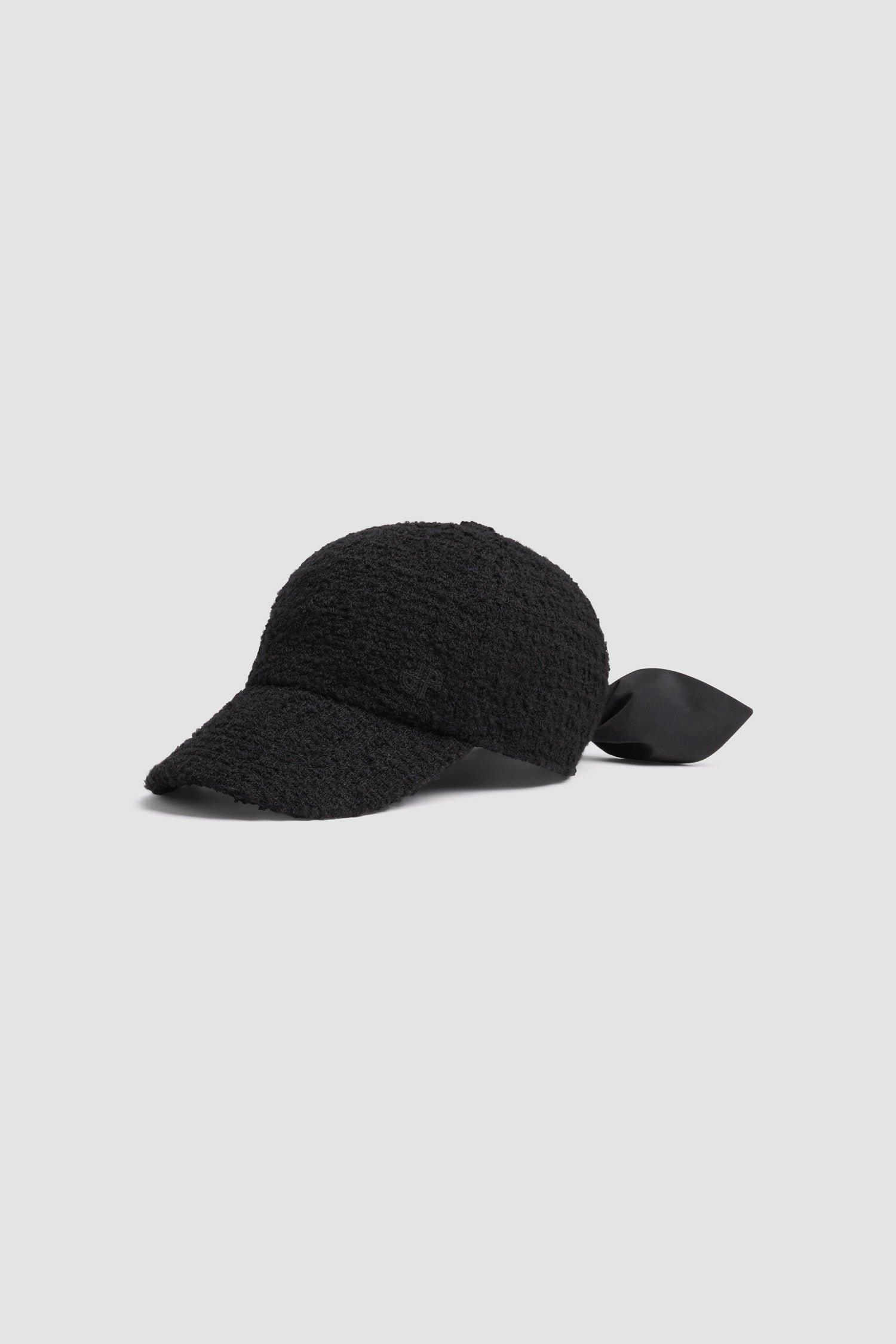 Patou - Couture cap in sustainable wool blend tweed - Black - Black sustainable wool blend tweed cap. Textured finish. Embroidered JP monogram at the front. Polyester faille bow fastening at the back.