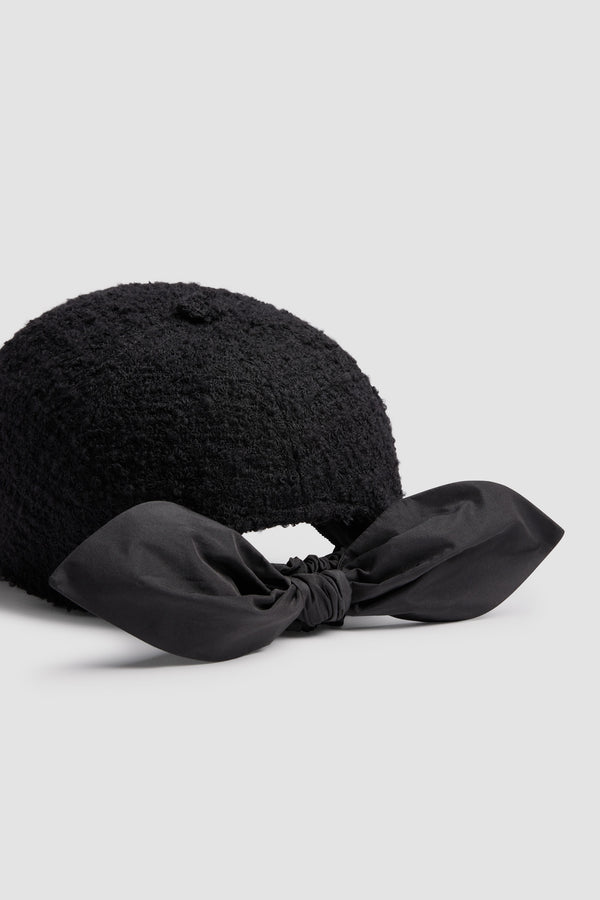 Patou - Couture cap in sustainable wool blend tweed - Black - Black sustainable wool blend tweed cap. Textured finish. Embroidered JP monogram at the front. Polyester faille bow fastening at the back.