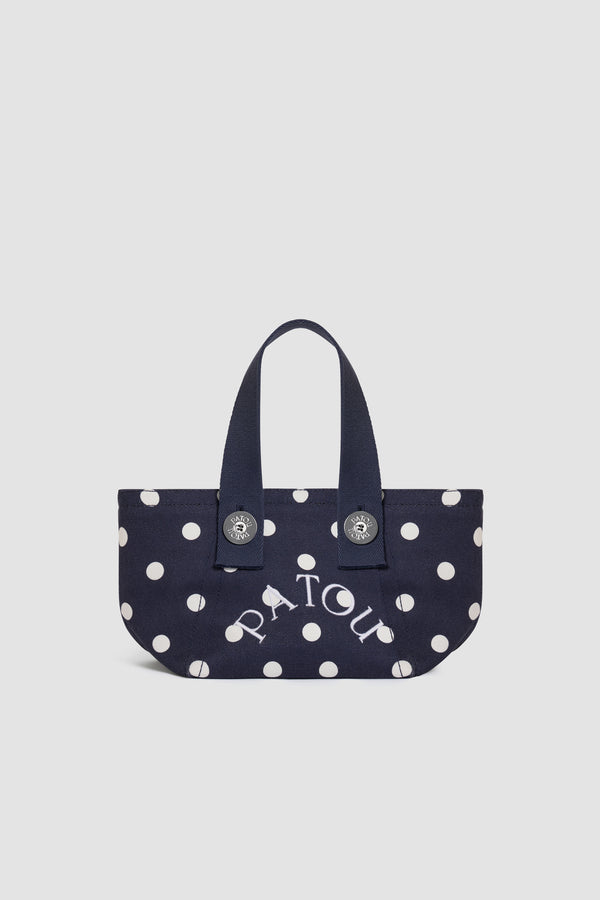 Patou - Borsa tote a trapezio PM in cotone biologico - Meteorite Blue - Borsa tote a trapezio piccola in cotone biologico blu navy a pois bianchi. Logo Patou ricamato bianco. Manici blu navy. Chiusura con bottone a pressione.