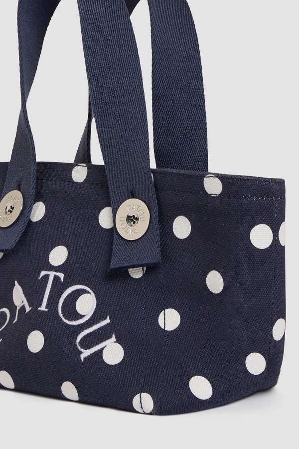 Patou - Borsa tote a trapezio PM in cotone biologico - Meteorite Blue - Borsa tote a trapezio piccola in cotone biologico blu navy a pois bianchi. Logo Patou ricamato bianco. Manici blu navy. Chiusura con bottone a pressione.