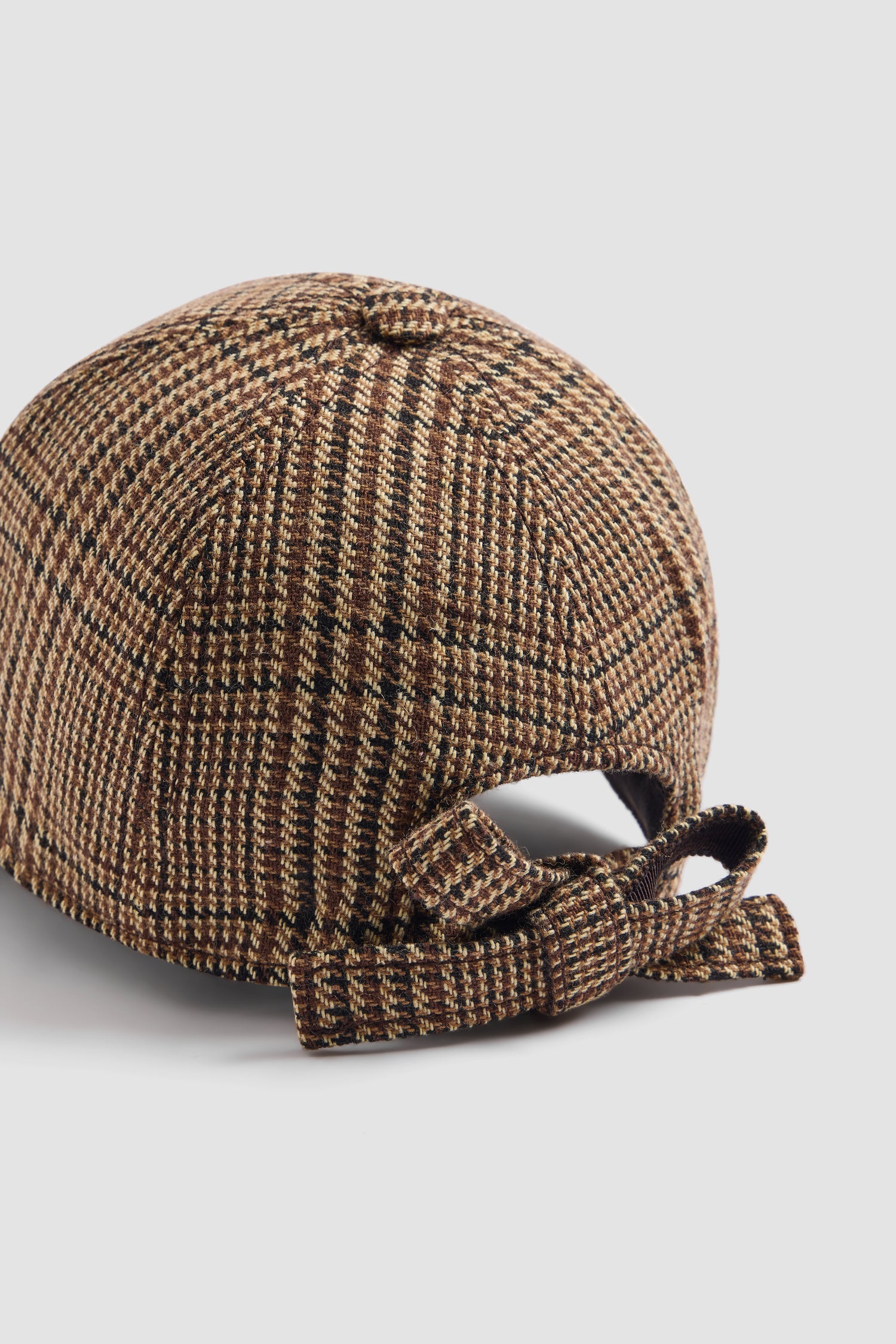 Patou - Cap mit Schleife - Autumn Prince Of Wales - Cap im Prince-of-Wales-Muster. Gebogener Schirm. Schleife hinten. JP-Monogramm vorne.