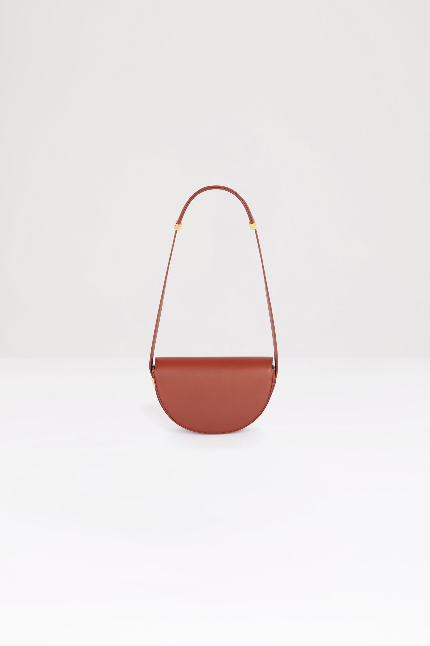 Patou - Le Petit Patou bag in leather - Maya Mountain - A smaller take on everyone&amp;#39;s favourite piece of Patou!Maya Mountain brown leather handbag. Crafted using unique materials sourced from unused high-quality leather hides. 120 limited numbered edition. Half-circle shape with geometric cut-outs inspired by the JP monogram. Gold-tone hardware with Patou-engraved detail at the side. Adjustable strap that allows it to be worn on the shoulder, across the body or carried by hand. Magnetic closure with gold-tone JP detail. Internal compartment. Eco lining.Measures: 20cm (length), 13cm (height), 5cm (depth)