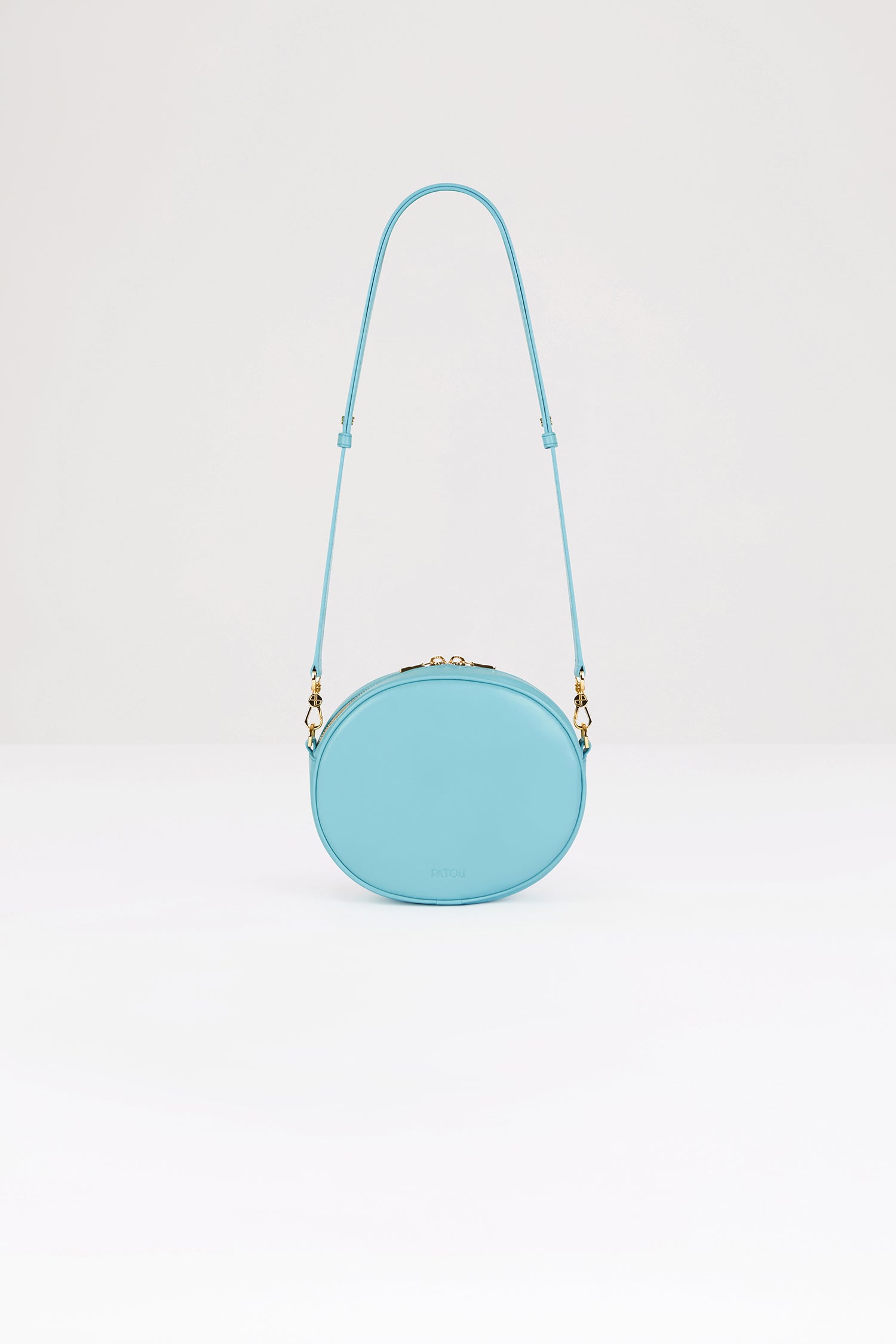 Patou - Le JP bag in leather - Blue Jewel - A darling newcomer to covet and carry the world over.Blue Jewel leather handbag. Crafted using unique materials sourced from unused high-quality leather hides. 60 limited numbered edition. Oval shape with a foam-padded 3D JP monogram at the front. Embossed Patou at the back. Two-way zip fastening. Single inside pocket. Detachable and adjustable strap. Gold-tone hardware. Eco lining.Measures: 21 cm (length), 18 cm (height), 7 cm (depth)Adjustable strap: 66 cm-110 cm