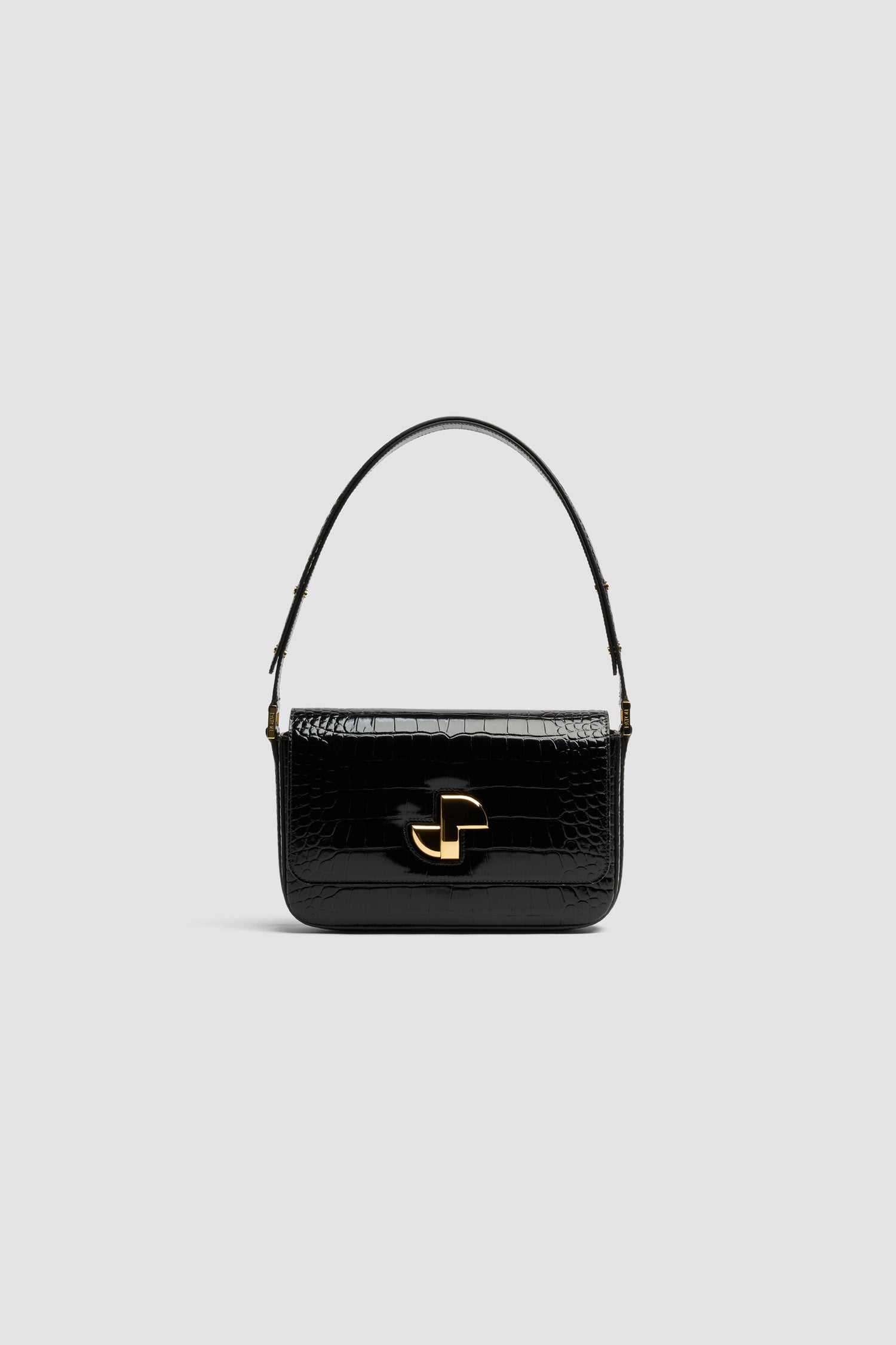 Patou - Le Classic Lock bag in crocodile-embossed leather - Black - Black crocodile-embossed leather handbag. Classic day bag inspiration with a twist. Gold Art Deco JP twist clasp at the front. Adjustable strap that allows it to be worn short or long. Leather lining.