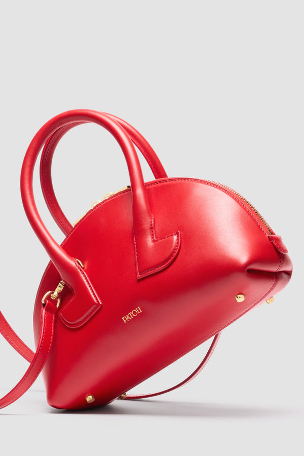 Patou - Borsa Le Patou Bowling in pelle - Lipstick Red - Borsa in pelle liscia color rossetto. Forma bowling. Doppio manico con dettagli geometrici. Tracolla rimovibile. Chiusura con zip oro a doppio cursore. Logo Patou oro sul davanti. Piedini in metallo oro.