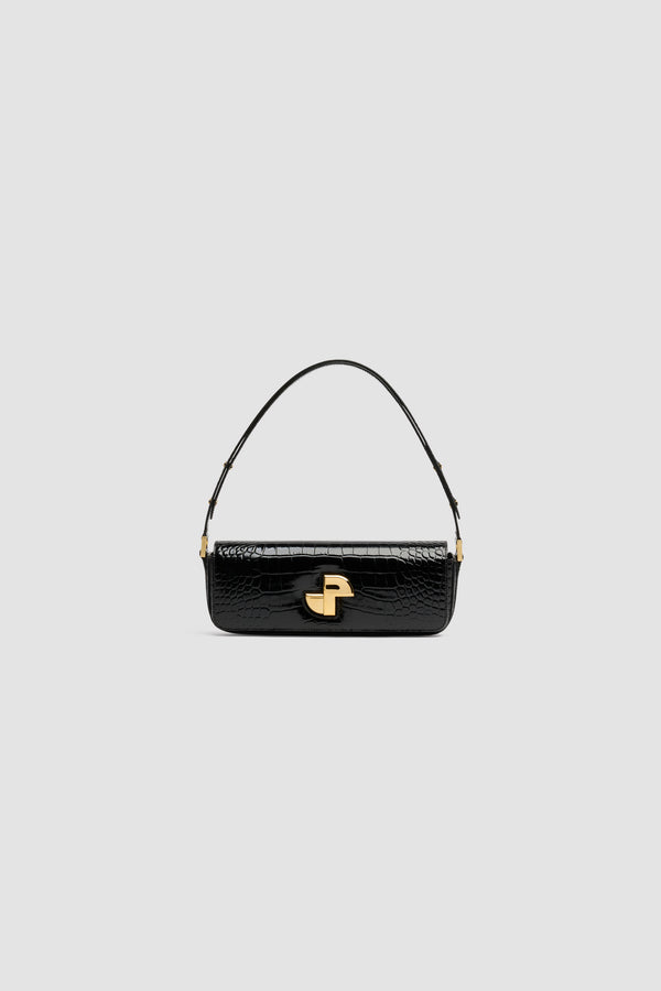 Patou - Le Long Lock bag in crocodile-embossed leather - Black - Black crocodile-embossed leather handbag. Classic day bag inspiration with an elongated shape. Gold Art Deco JP twist clasp at the front. Adjustable strap that allows it to be worn short or long. Leather lining.