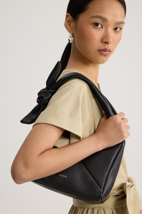 Patou - Leather Bag - Black - Leather bag in black leather. Triangular shape. Knotted handle. Side zip closure.