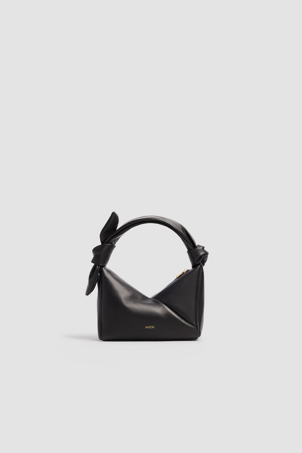 Patou - Leather Bag - Black - Leather bag in black leather. Triangular shape. Knotted handle. Side zip closure.