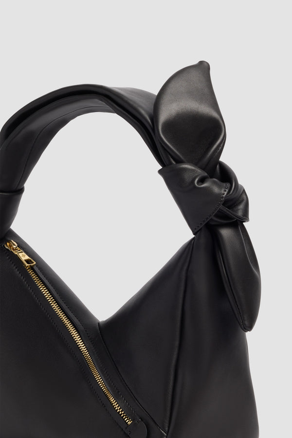 Patou - Leather Bag - Black - Leather bag in black leather. Triangular shape. Knotted handle. Side zip closure.
