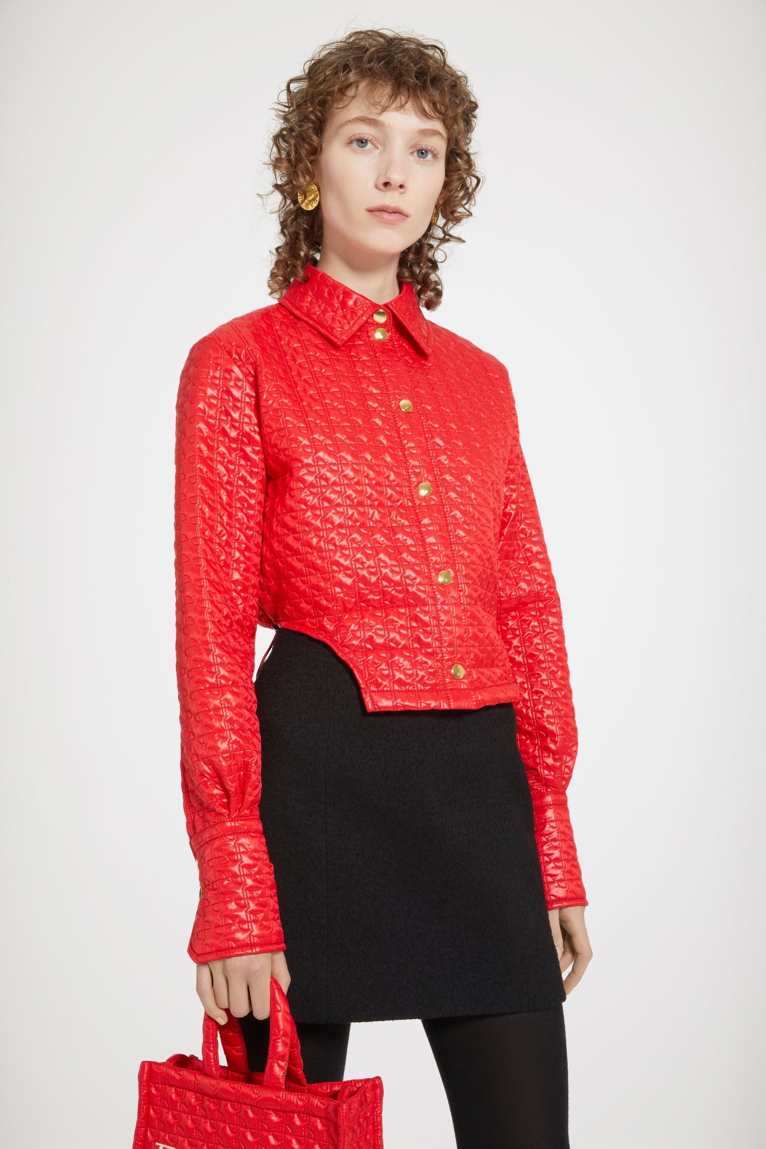 Patou - Cut-out cropped shirt in eco-friendly quilted nylon - Red Ski Slope - A new silhouette that hits all the right notes.Red eco-friendly nylon shirt. Signature JP quilting. Cropped silhouette with violin-shaped cut-outs at the sides. Gold-tone press buttons at the front and cuffs. Partly elasticated waist with adjustable drawstring at the back and toggle detail.