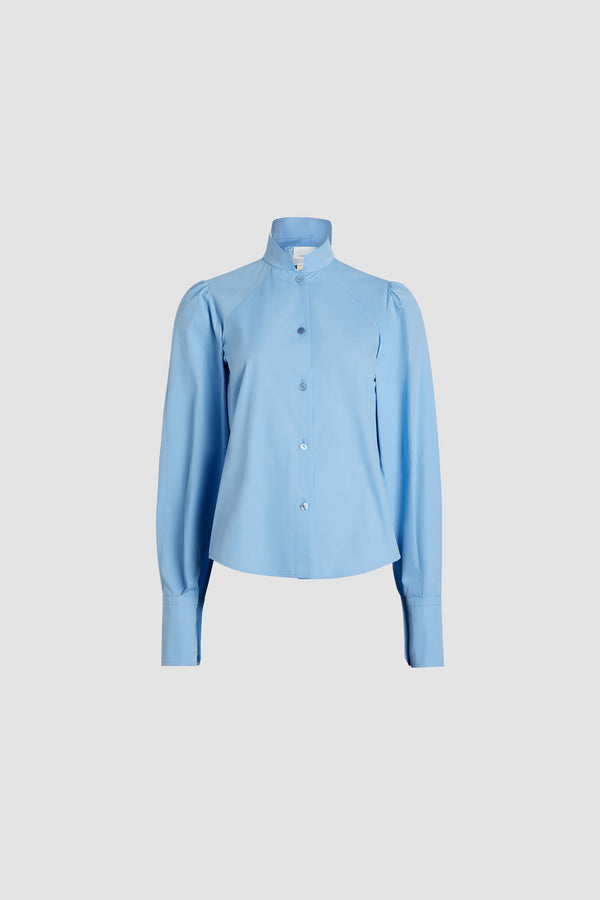 Patou - Lavallière blouse in organic cotton - Airy Blue - Airy Blue organic cotton blouse. Stand collar with removable lavallière bow. JP-engraved mother-of-pearl buttons. Volume raglan sleeves with puff shoulders and buttoned French cuffs.