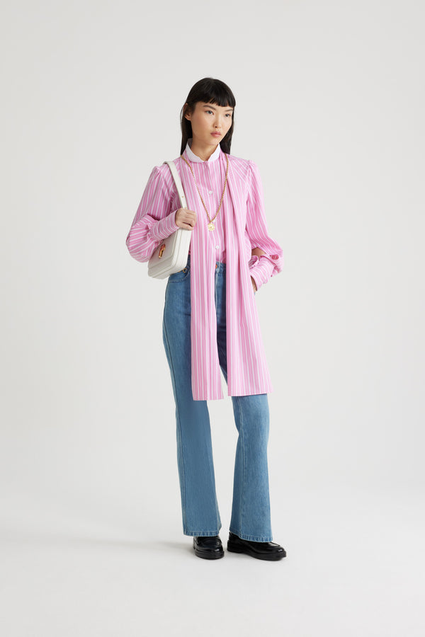 Patou - Lavallière blouse in printed sustainable cotton - Pink Stripes - Pink sustainable cotton blouse. Striped pattern. Contrast collar with removable lavallière bow. JP-engraved mother-of-pearl buttons. Volume raglan sleeves with puff shoulders and buttoned French cuffs. Embroidered Patou and JP at the front.