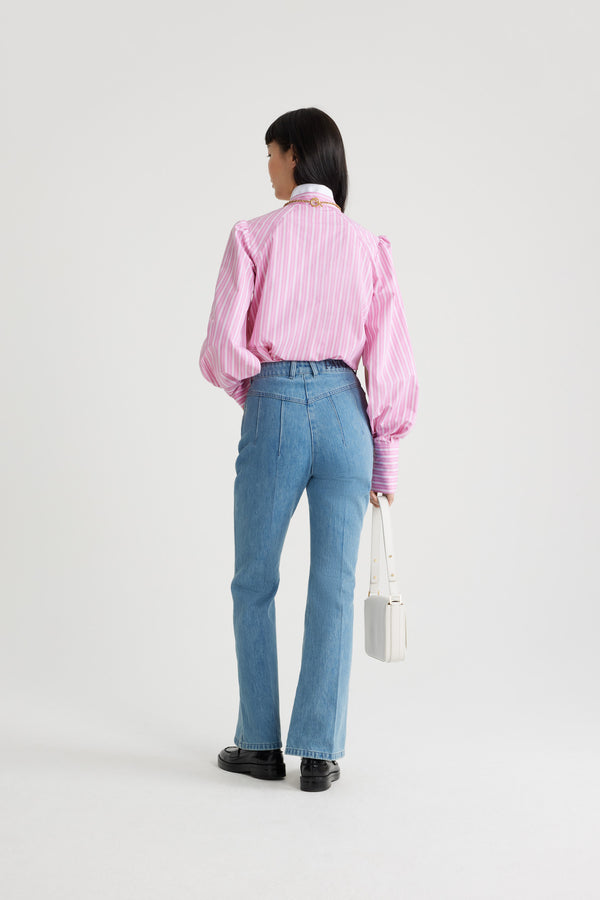 Patou - Lavallière blouse in printed sustainable cotton - Pink Stripes - Pink sustainable cotton blouse. Striped pattern. Contrast collar with removable lavallière bow. JP-engraved mother-of-pearl buttons. Volume raglan sleeves with puff shoulders and buttoned French cuffs. Embroidered Patou and JP at the front.