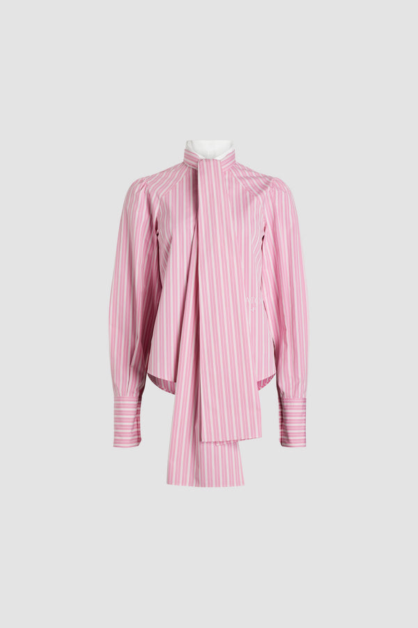 Patou - Lavallière blouse in printed sustainable cotton - Pink Stripes - Pink sustainable cotton blouse. Striped pattern. Contrast collar with removable lavallière bow. JP-engraved mother-of-pearl buttons. Volume raglan sleeves with puff shoulders and buttoned French cuffs. Embroidered Patou and JP at the front.