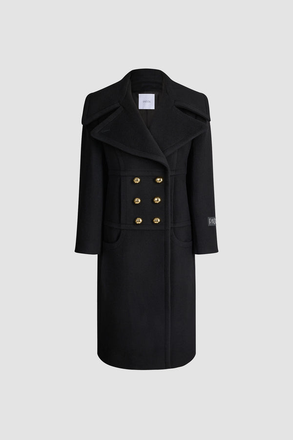 Patou - Manteau croisé en laine mélangée éco-responsable - Black - Manteau en laine mélangée éco-responsable noire. Modèle long. Silhouette droite. Construction à double boutonnage. Revers en pointe larges. Boutons boule dorés à monogramme JP. Coutures arrondies à l’avant. Poches dans les coutures. Étiquette Patou sur la manche gauche. Modèle doublé.