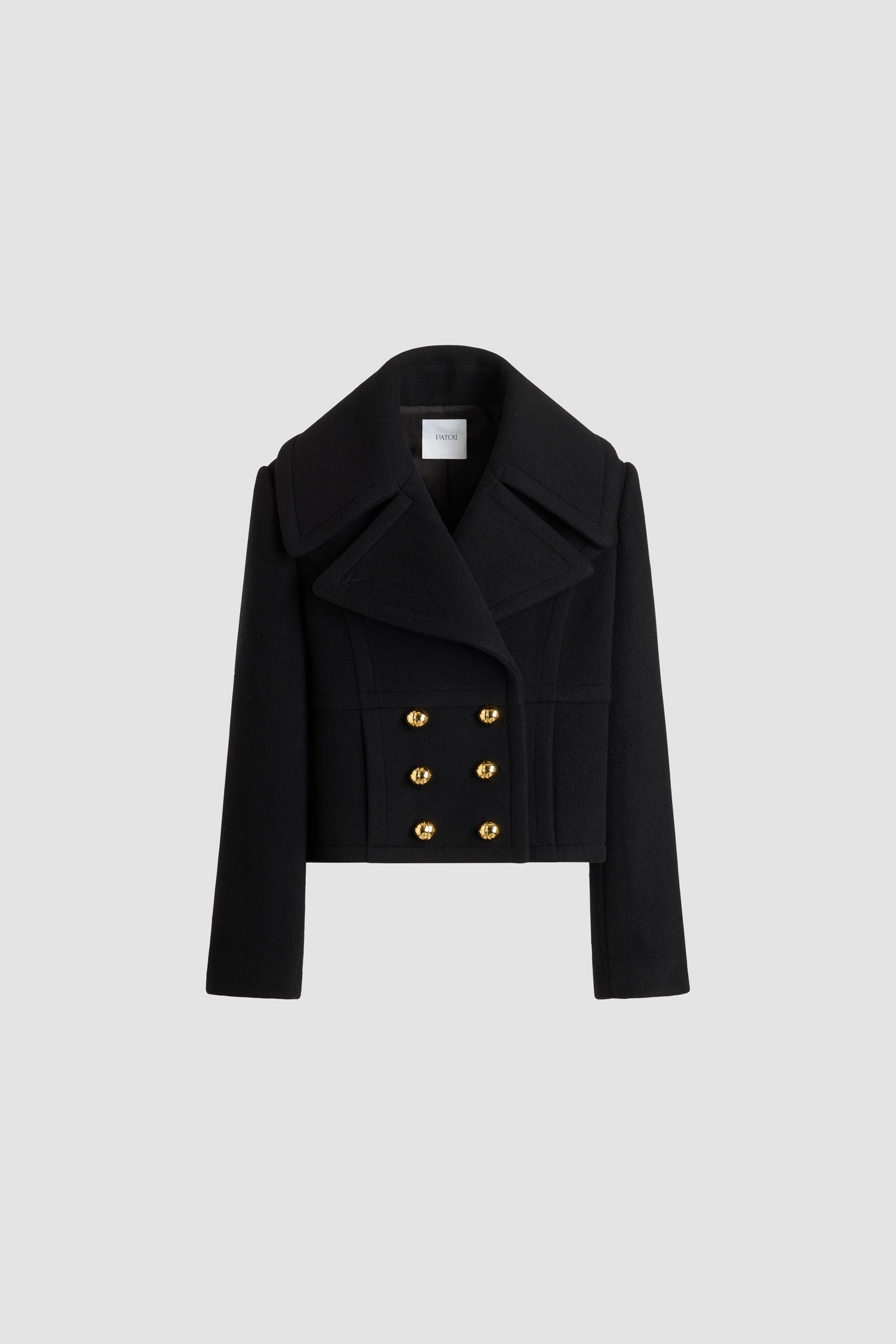 Patou - Cropped double-breasted coat in sustainable wool blend - No Label Black - Black sustainable wool blend coat. Cropped length. Straight silhouette. Double-breasted construction. Wide peak lapel. Gold-tone half-sphere JP monogram buttons. Curved seams at the front. Seam pockets. Lined.