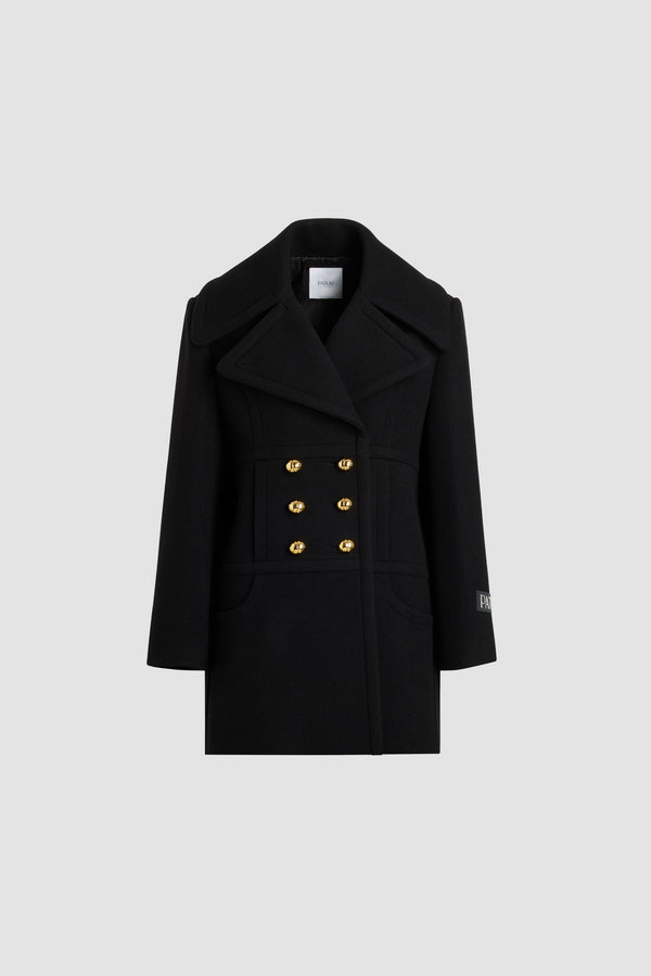 Patou - Cappotto doppiopetto in misto lana sostenibile - Black - Cappotto in misto lana sostenibile nero. Lunghezza a mezza coscia. Silhouette dritta. Costruzione doppiopetto. Ampi rever a lancia. Bottoni oro semisferici con monogramma JP. Cuciture curve sul davanti. Tasche integrate nelle cuciture. Etichetta con logo Patou sulla manica sinistra. Modello foderato.