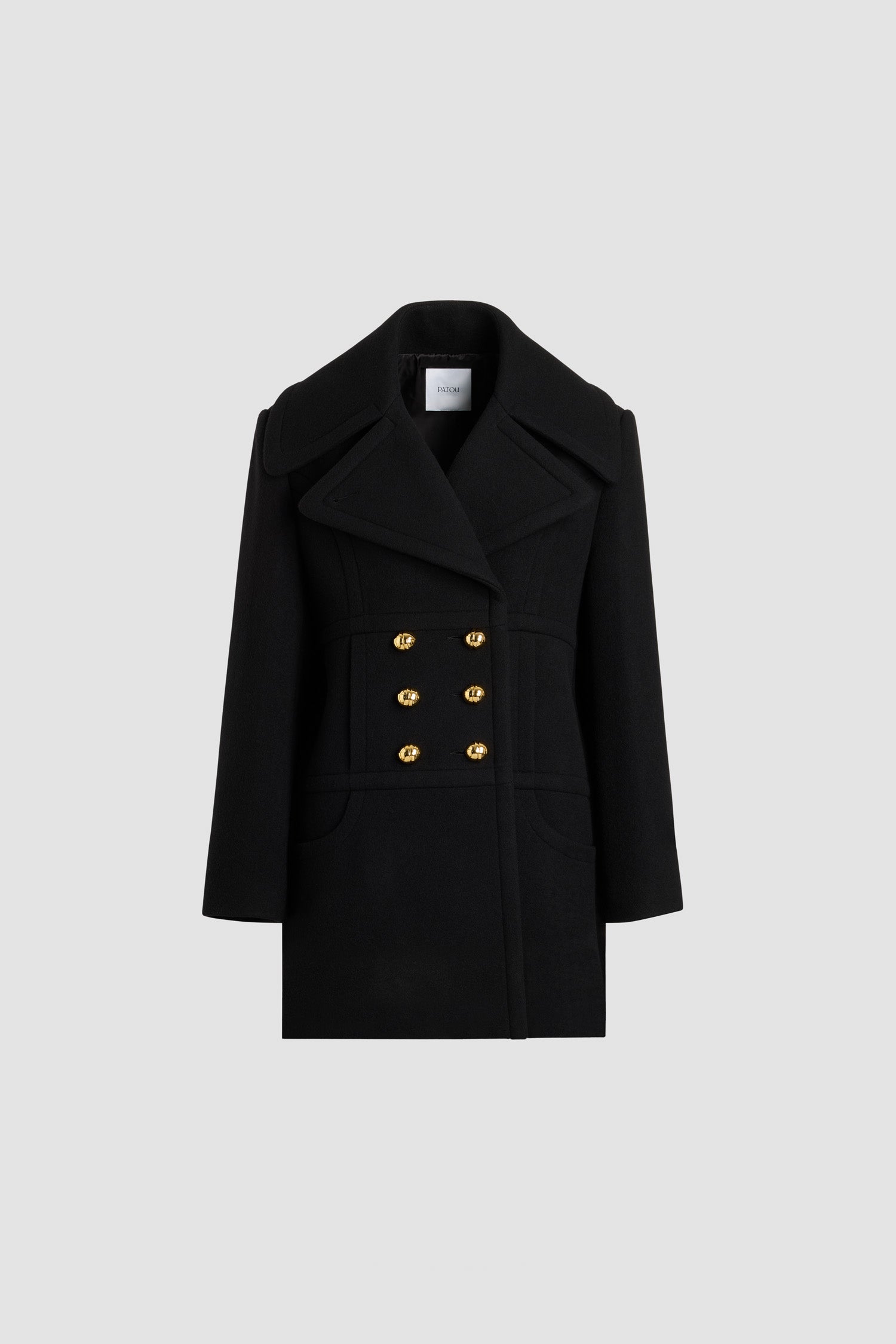 Patou - Double-breasted coat in sustainable wool blend - No Label Black - Black sustainable wool blend coat. Mid-thigh length. Straight silhouette. Double-breasted construction. Wide peak lapel. Gold-tone half-sphere JP monogram buttons. Curved seams at the front. Seam pockets. Lined.