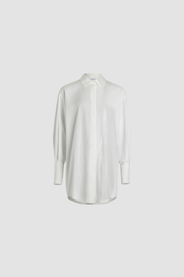 Patou - Vestito camicia corto in cotone bio - White - Da solo o sovrapposto, il vestito Patou da indossare in tutti i modi.Vestito in popeline di cotone bio bianco. Modello corto e oversize. Chiusura con bottoni nascosti incisi JP. Logo Patou ricamato sul fronte. Cucitura curva signature sul retro, Polsini abbottonati.Vestibilità oversize.