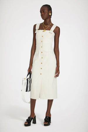 Dungaree dress in regenerated cotton denim