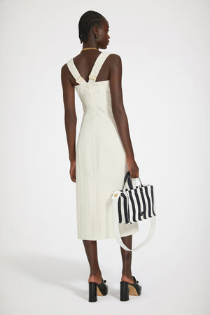 Dungaree dress in regenerated cotton denim