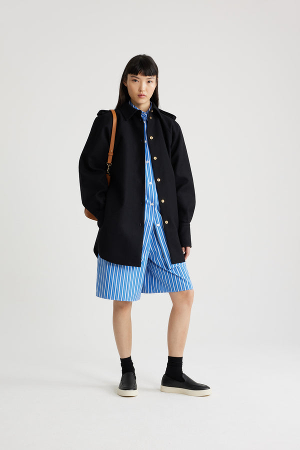 Patou - Mini shirt dress in sustainable wool blend - Black - Black sustainable wool blend flannel dress. Short length. Straight silhouette. Shirt collar. Gold-tone JP-engraved buttons. Volume raglan sleeves. Buttoned cuffs. Removable self-tie belt at the waist. Embroidered Patou and JP at the front. Lined.