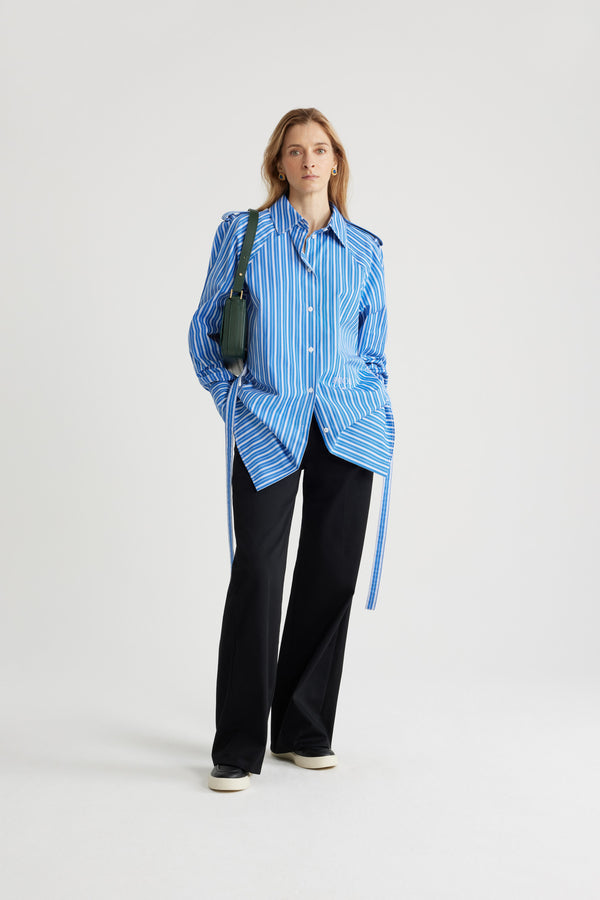 Patou - Mini shirt dress in printed sustainable cotton - Victoria Blue Stripes - Victoria Blue sustainable cotton poplin dress. Striped pattern. Short length. Straight silhouette. Shirt collar. JP-engraved mother-of-pearl buttons. Shoulder tabs. Volume raglan sleeves. Buttoned cuffs. Removable self-tie belt at the waist. Embroidered Patou and JP at the front.