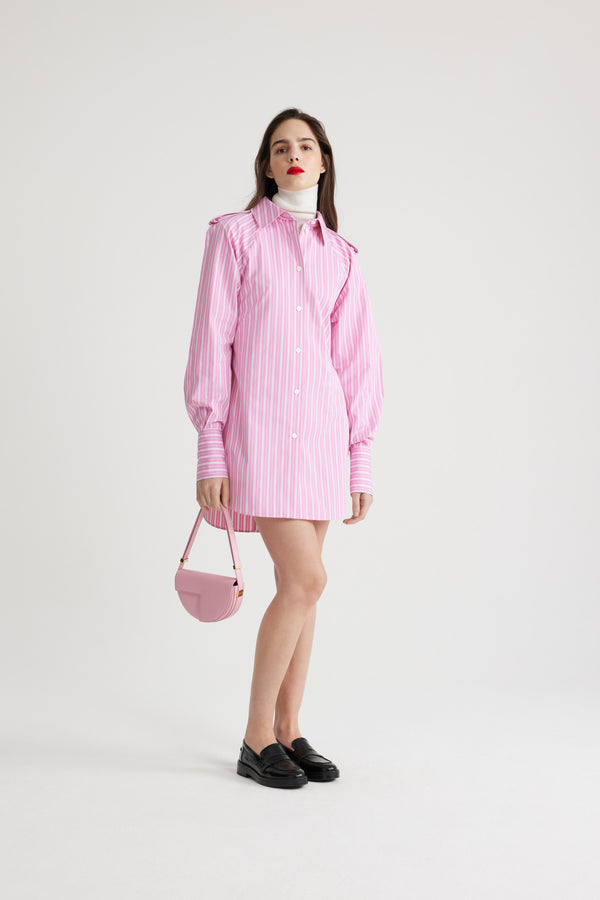 Patou - Mini shirt dress in printed sustainable cotton - Pink Stripes - Pink sustainable cotton poplin dress. Striped pattern. Short length. Straight silhouette. Shirt collar. JP-engraved mother-of-pearl buttons. Shoulder tabs. Volume raglan sleeves. Buttoned cuffs. Removable self-tie belt at the waist. Embroidered Patou and JP at the front.